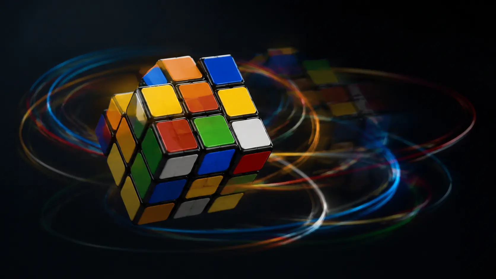 A scrambled Rubik's Cube hangs in a dark studio.